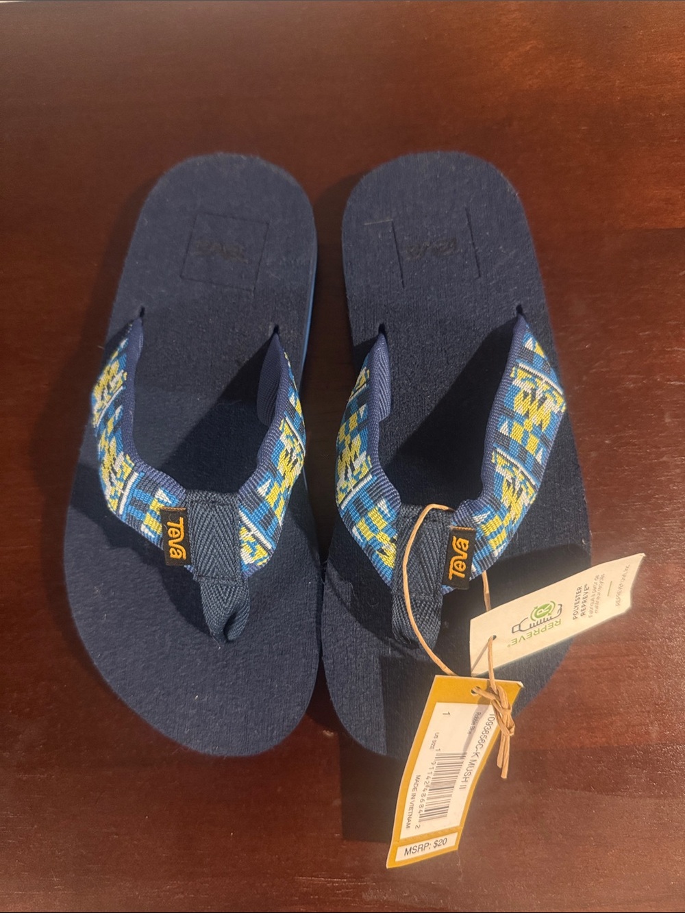 Teva Kids Navy Blue Flip Flops with Blue-Yellow Patterned Straps